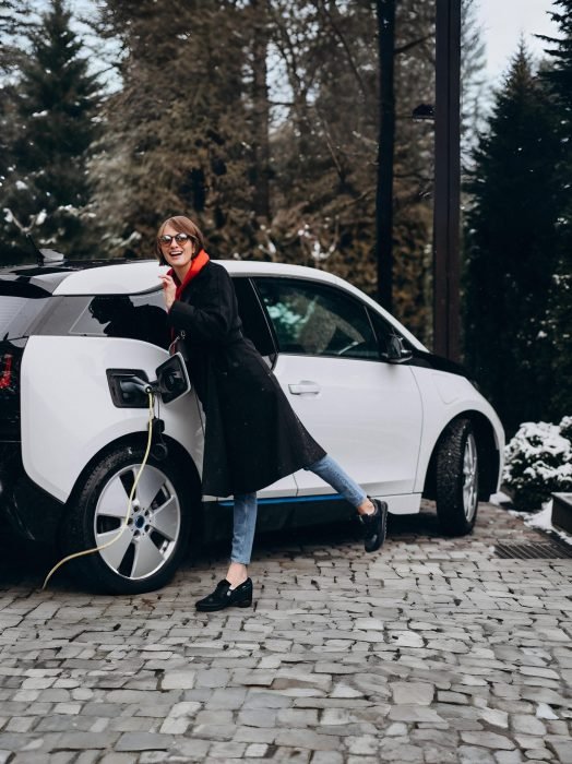 woman-charging-electro-car-by-her-house (1)-min
